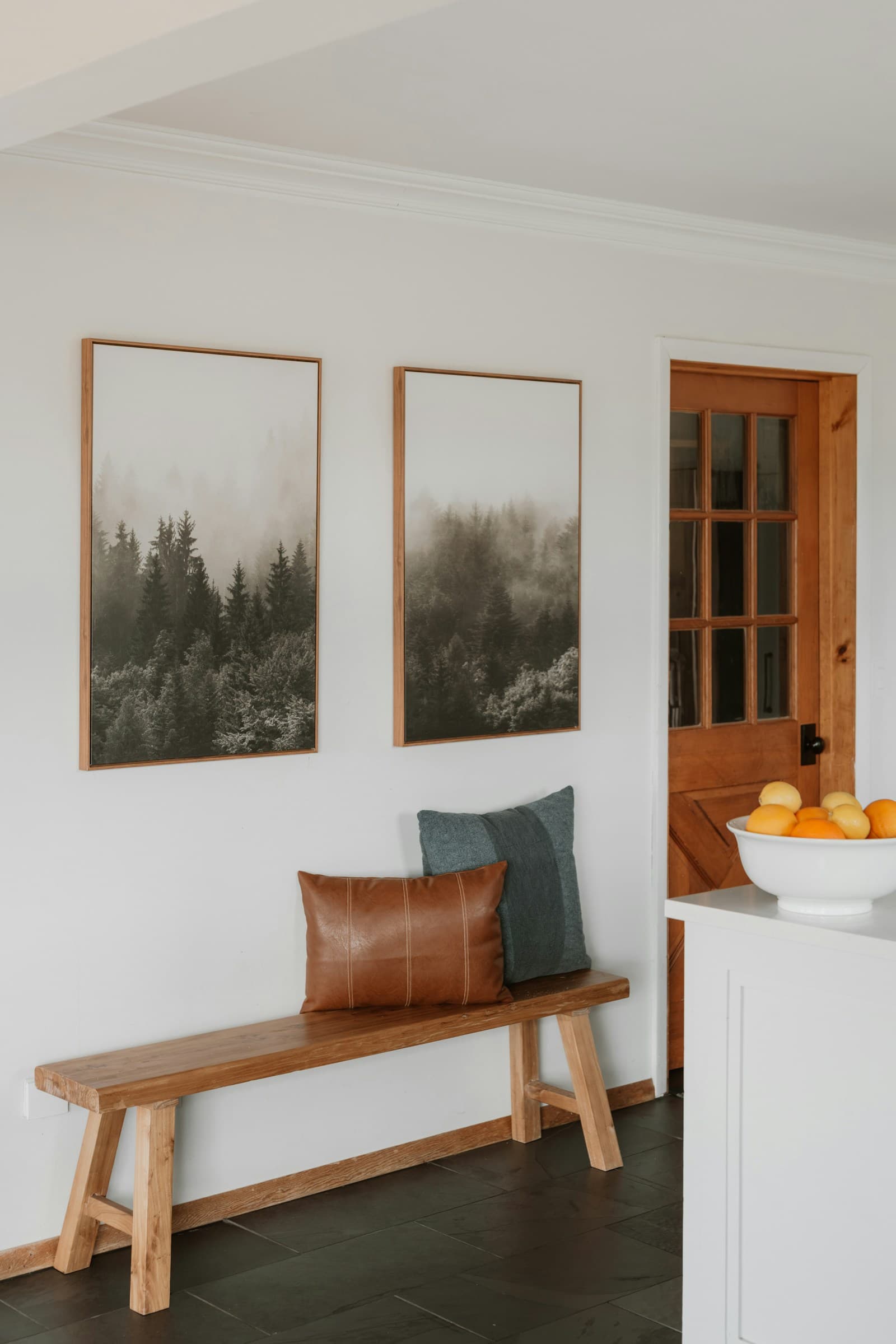 Wood entryway bench with pillows