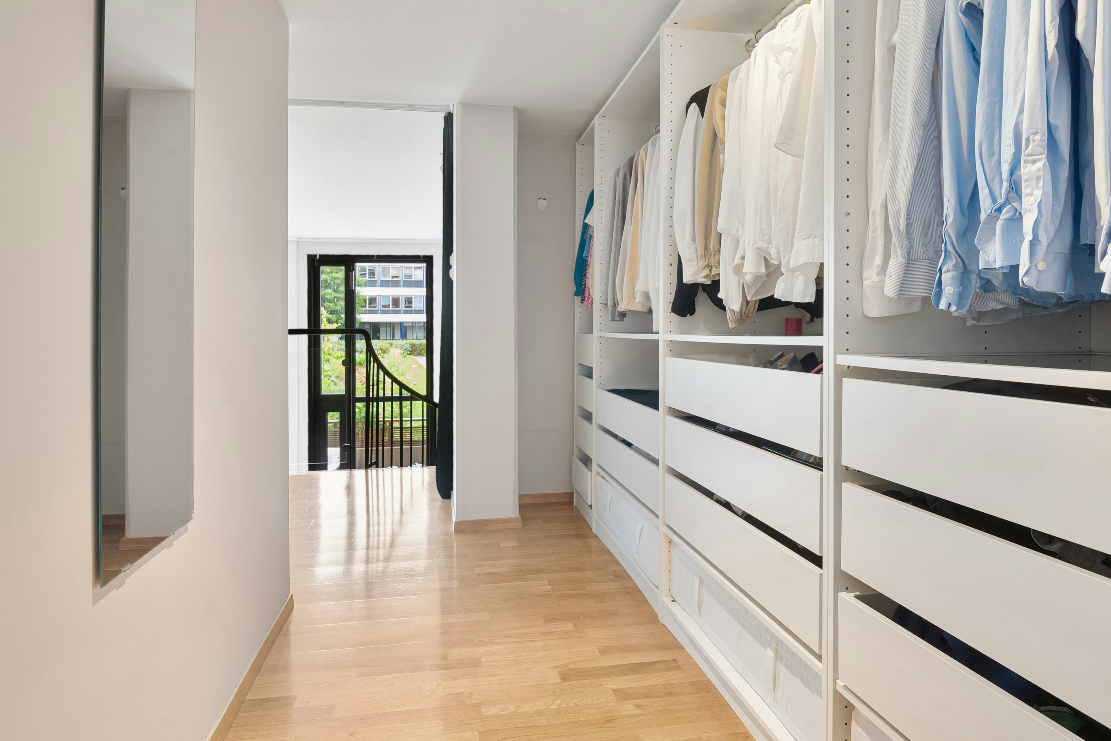 White built-in wardrobe and storage cabinetry